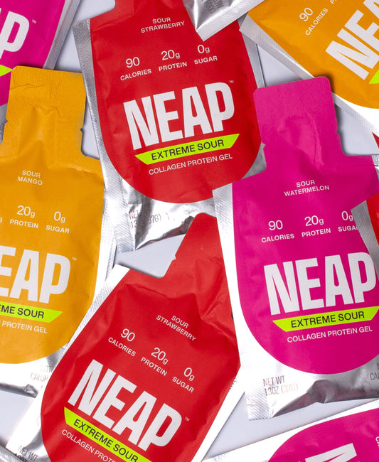 NEAP Extreme Sour collagen protein gel packets in various flavors on a gray background