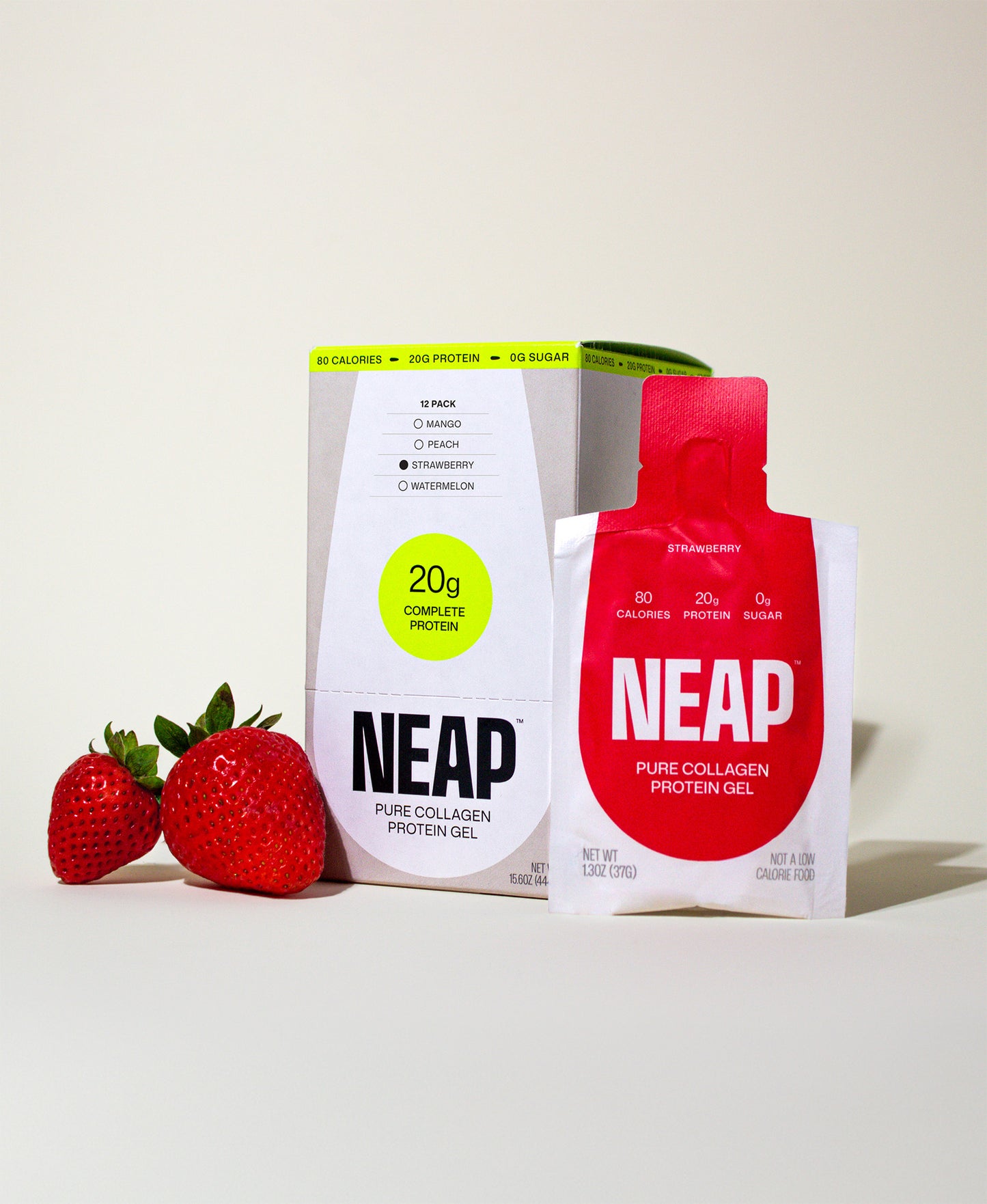 Strawberry NEAP pure collagen complete protein gel box, pouch, and fresh strawberries on a neutral background.